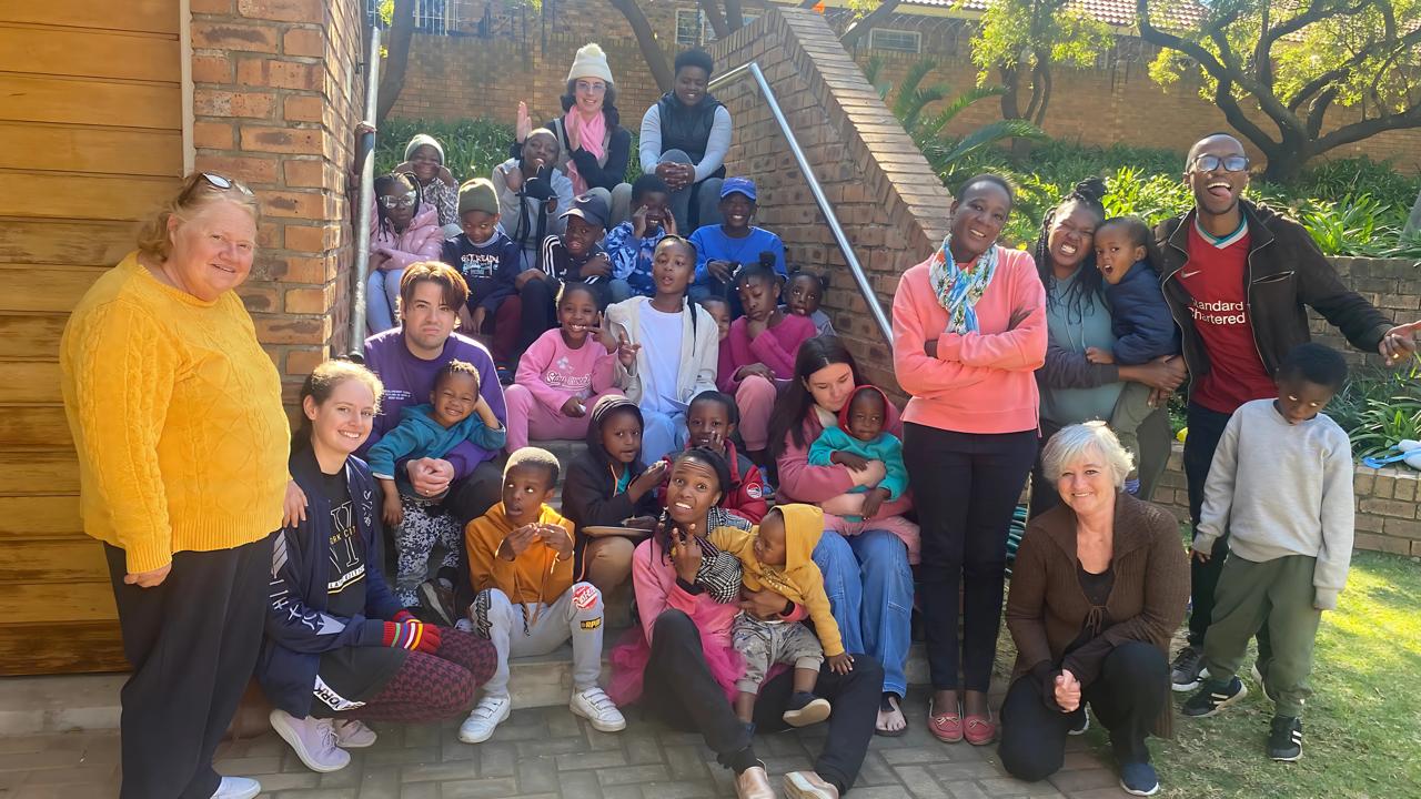 Joyful South African children in church children's program learning about faith