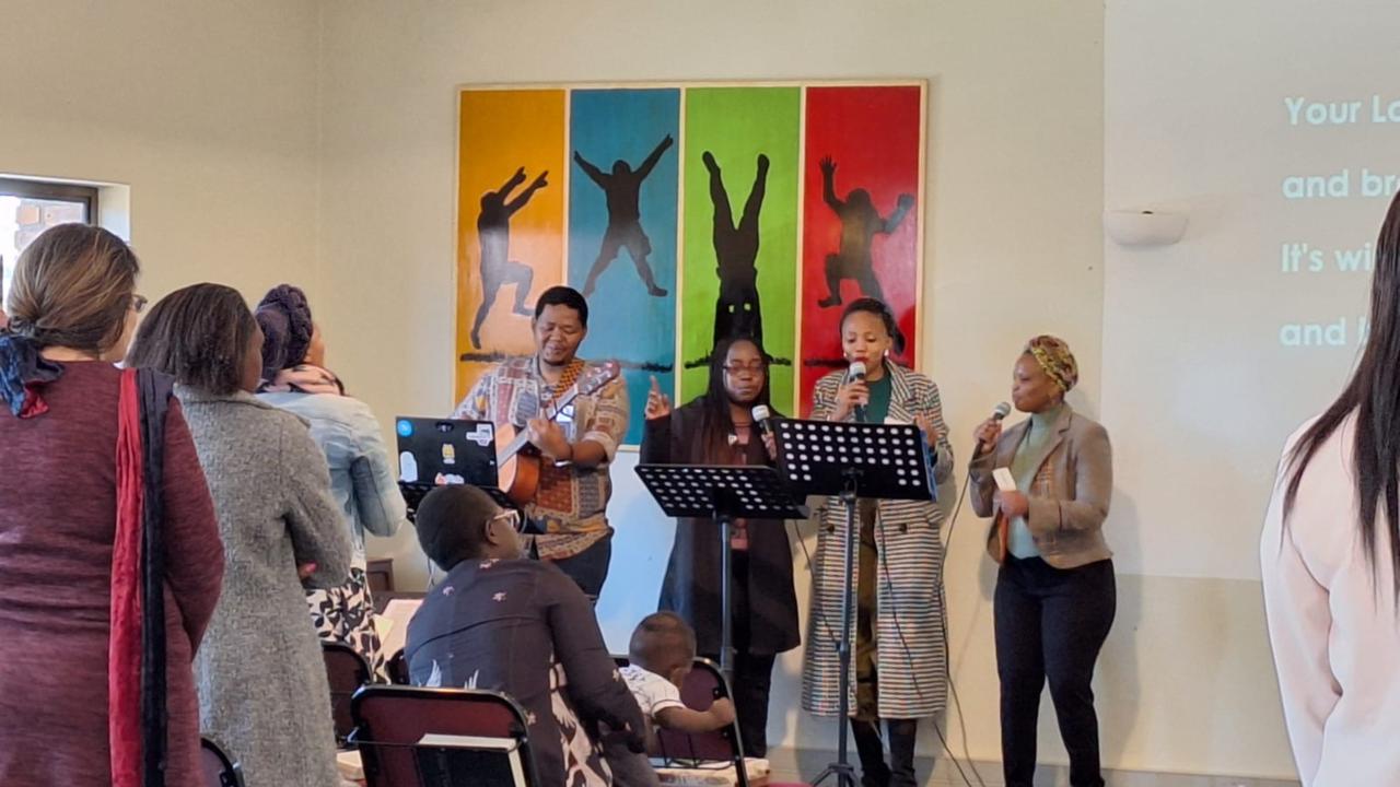 Diverse congregation in reverent prayer and communion worship