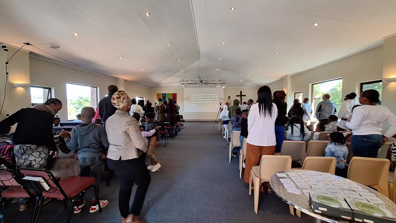 Diverse congregation worshipping together on Sunday morning